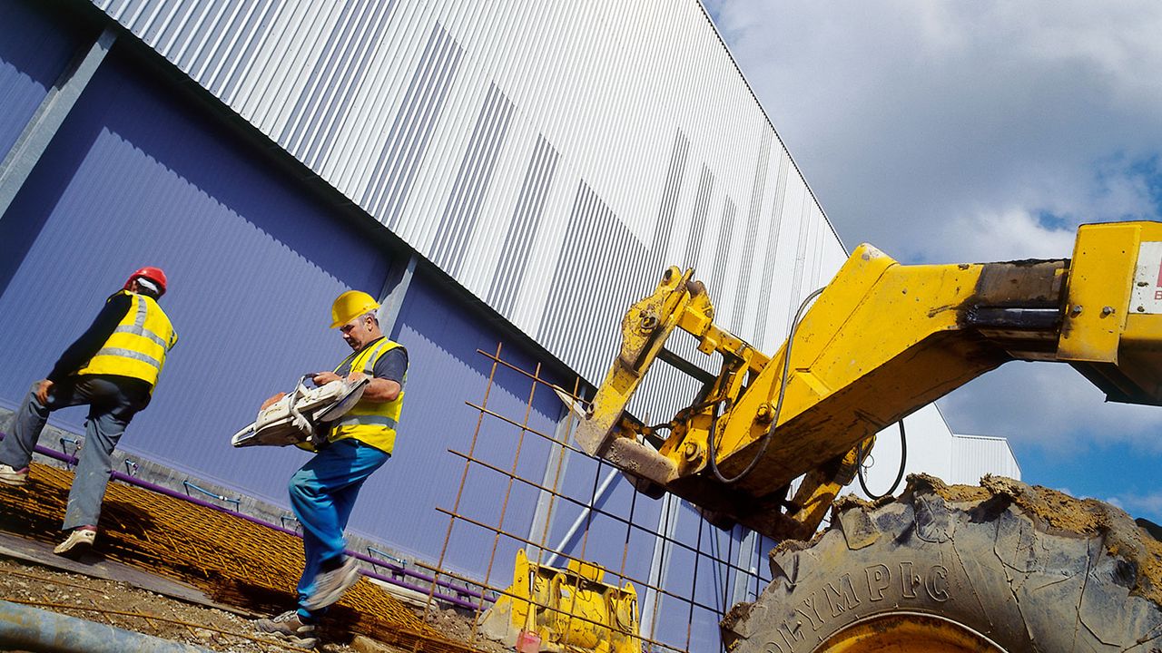 builders and a warehouse