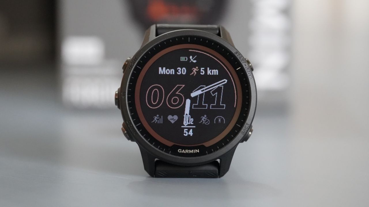 Garmin Forerunner 955 Solar review: pictured here, the watch on a desk in front of its box