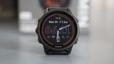 Garmin Forerunner 955 Solar review: pictured here, the watch on a desk in front of its box