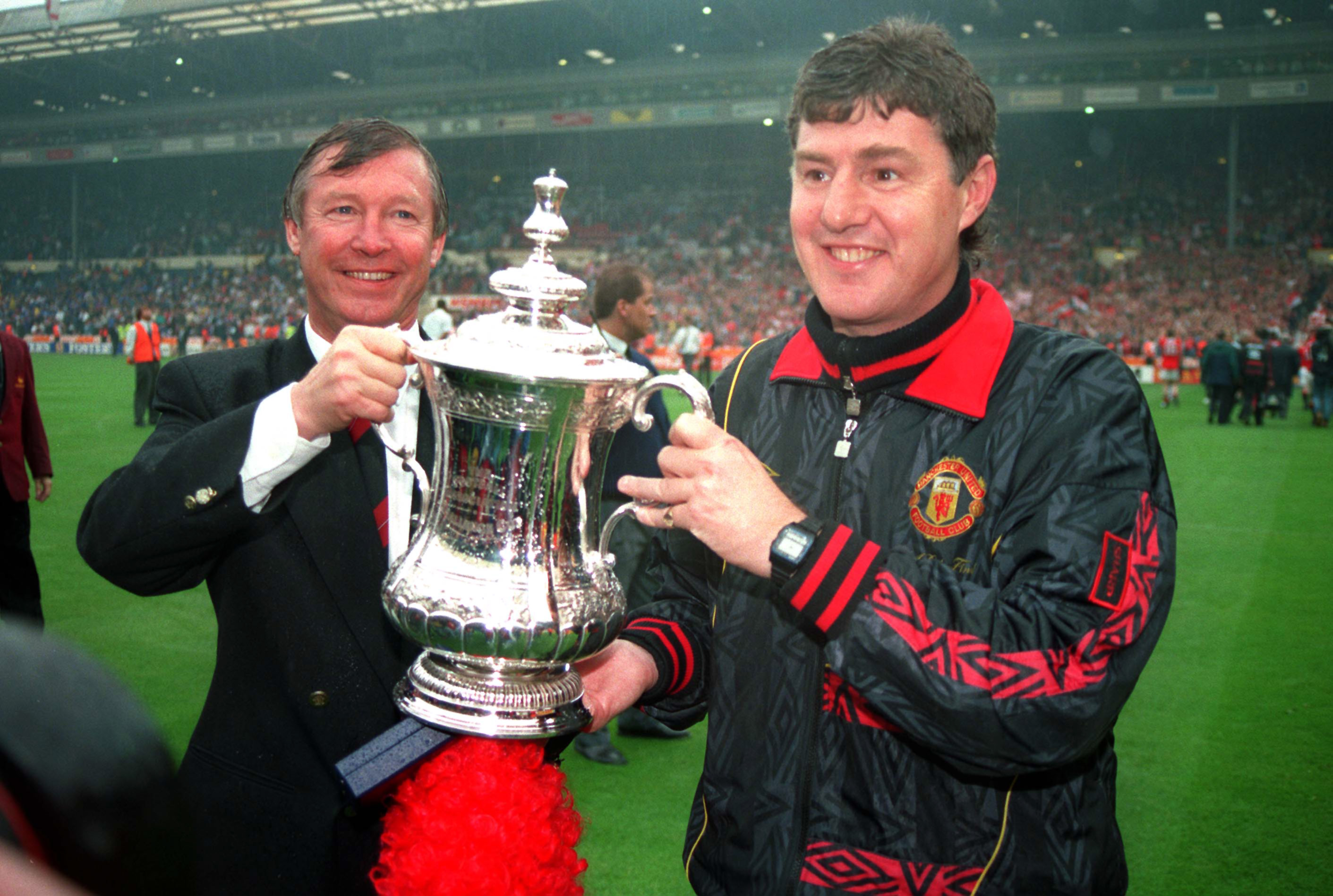 Brian Kidd (right) celebrates Manchester United's 1994 FA Cup win with manager Alex Ferguson.