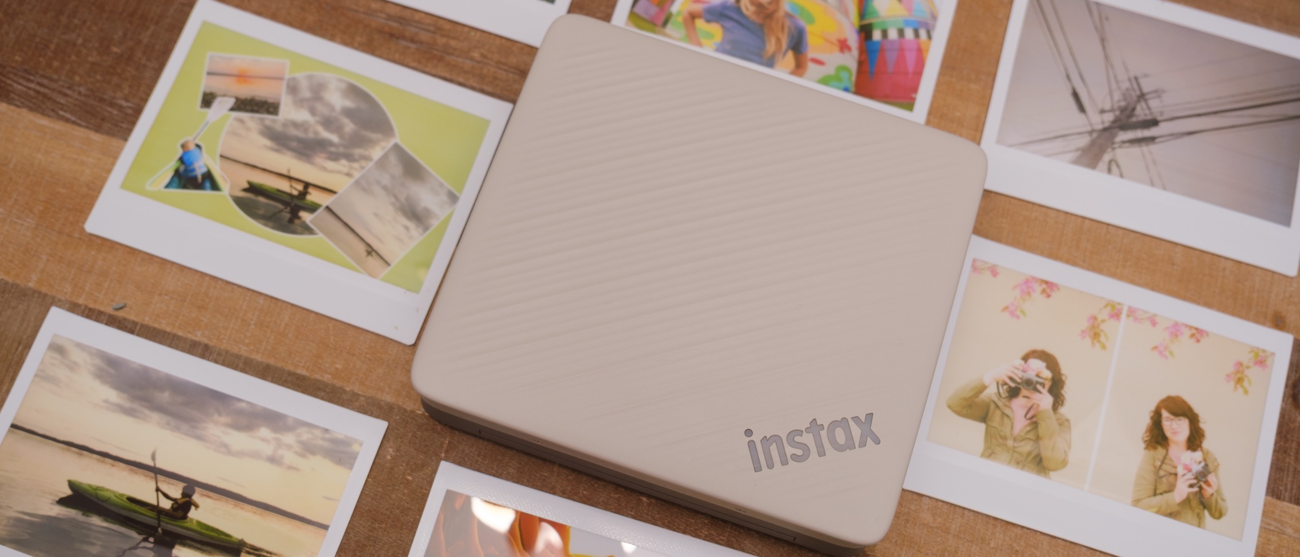 The Fujifilm Instax Link Wide 2 photo printer on a bookshelf