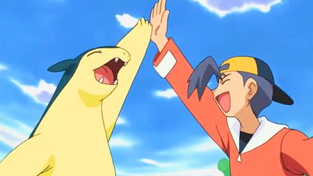 A Typhlosion gives their Pokemon trainer a high-five