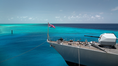 A British military ship pictured in a clear blue sea