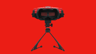 Virtual Boy headset with inside of goggles facing forward and red backdrop.