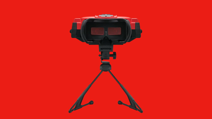 Virtual Boy headset with inside of goggles facing forward and red backdrop.