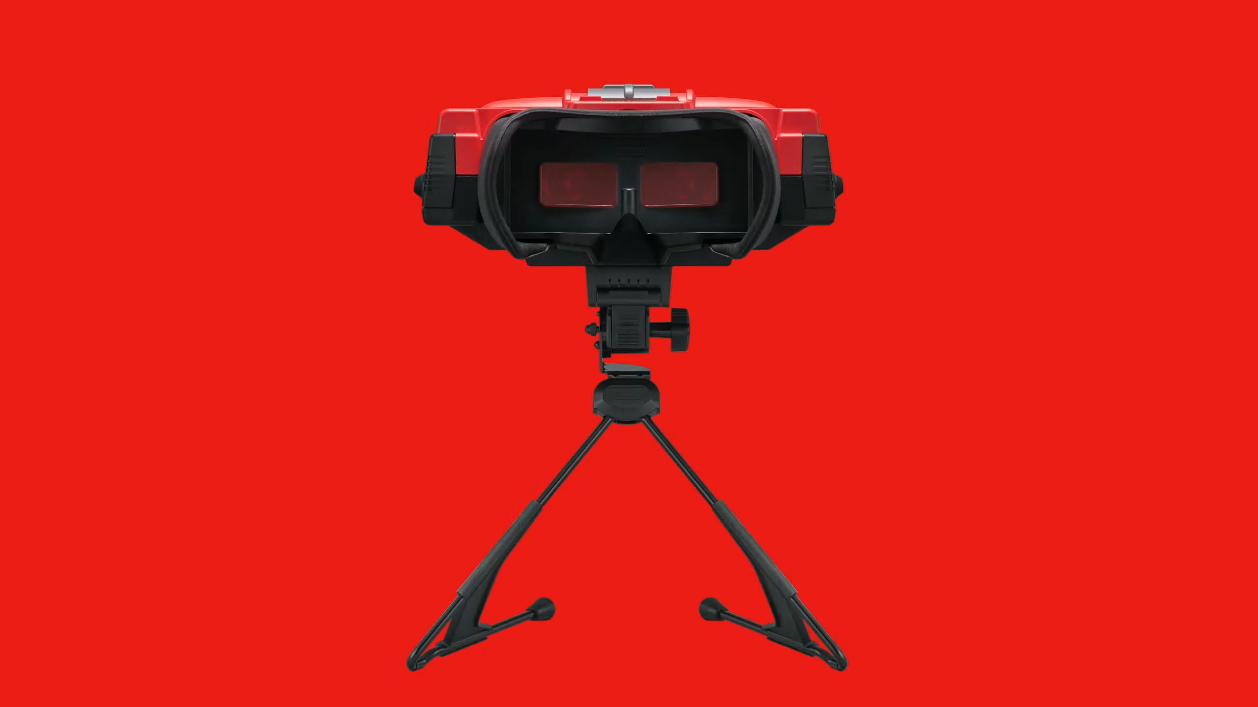 Virtual Boy headset with inside of goggles facing forward and red backdrop.