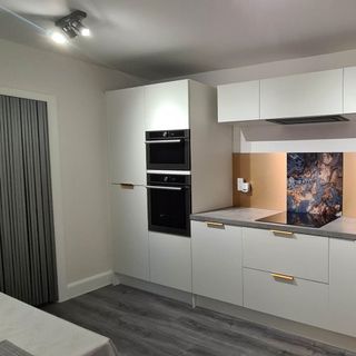 white kitchen with built in oven