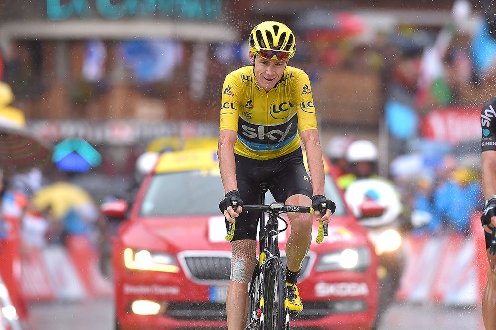 Chris Froome crosses the finish line of stage 20 at the Tour de France.