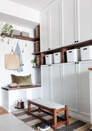 A mud room with storage designed with Ikea Billy bookcase