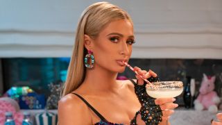 Paris Hilton drinking cocktail through candy straw in Cooking with Paris