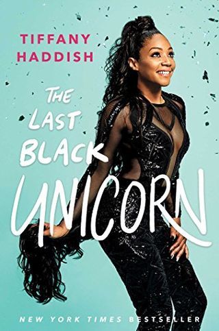 The Last Black Unicorn book cover with a photo of tiffany haddish smiling in an all black outfit and holding a long pony tail