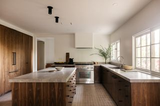 A kitchen with an island in the middle