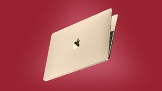 An Apple MacBook Air on a red background