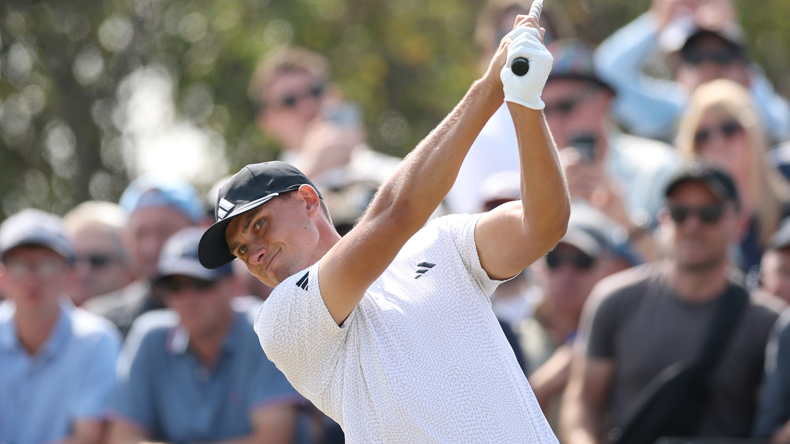 Ludvig Aberg hits an approach shot