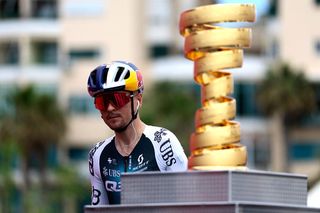 Q36.5 Pro Cycling team's British rider Thomas Pidcock walks past the Giro d'Italia trophy (âtrofeo senza fineâ) prior to the first stage of the 108th Giro d'Italia cycling race, 160km from Durres to Tirana in Albania, on May 9, 2025. (Photo by Luca Bettini / AFP)