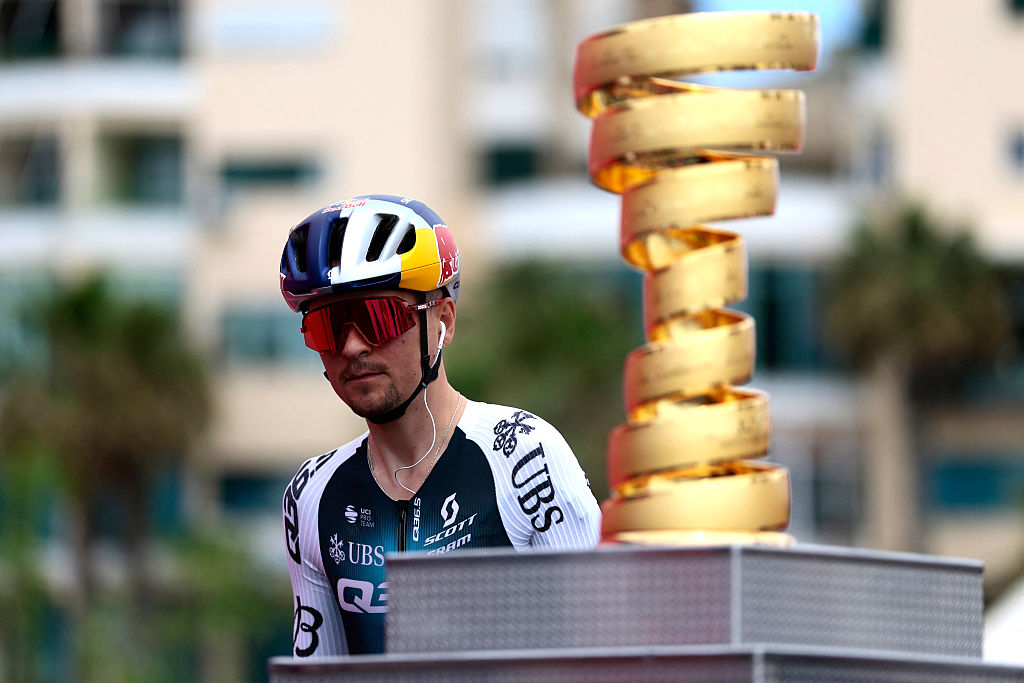 Q36.5 Pro Cycling team's British rider Thomas Pidcock walks past the Giro d'Italia trophy (â€œtrofeo senza fineâ€) prior to the first stage of the 108th Giro d'Italia cycling race, 160km from Durres to Tirana in Albania, on May 9, 2025. (Photo by Luca Bettini / AFP)