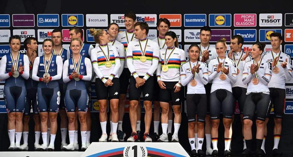 Riders from Switzerland celebrate with their gold medals and cow mascots after the Team Time Trial Mixed Relay road race during the UCI Cycling World Championships in Glasgow Scotland on August 8 2023 France L won silver and Germany R bronze Photo by Oli SCARFF AFP Photo by OLI SCARFFAFP via Getty Images