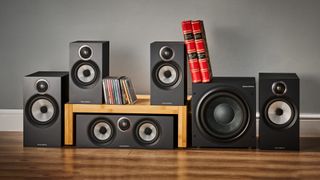 Bowers & Wilkins 606 & 607 S3 surround speaker package arranged with books and CDs