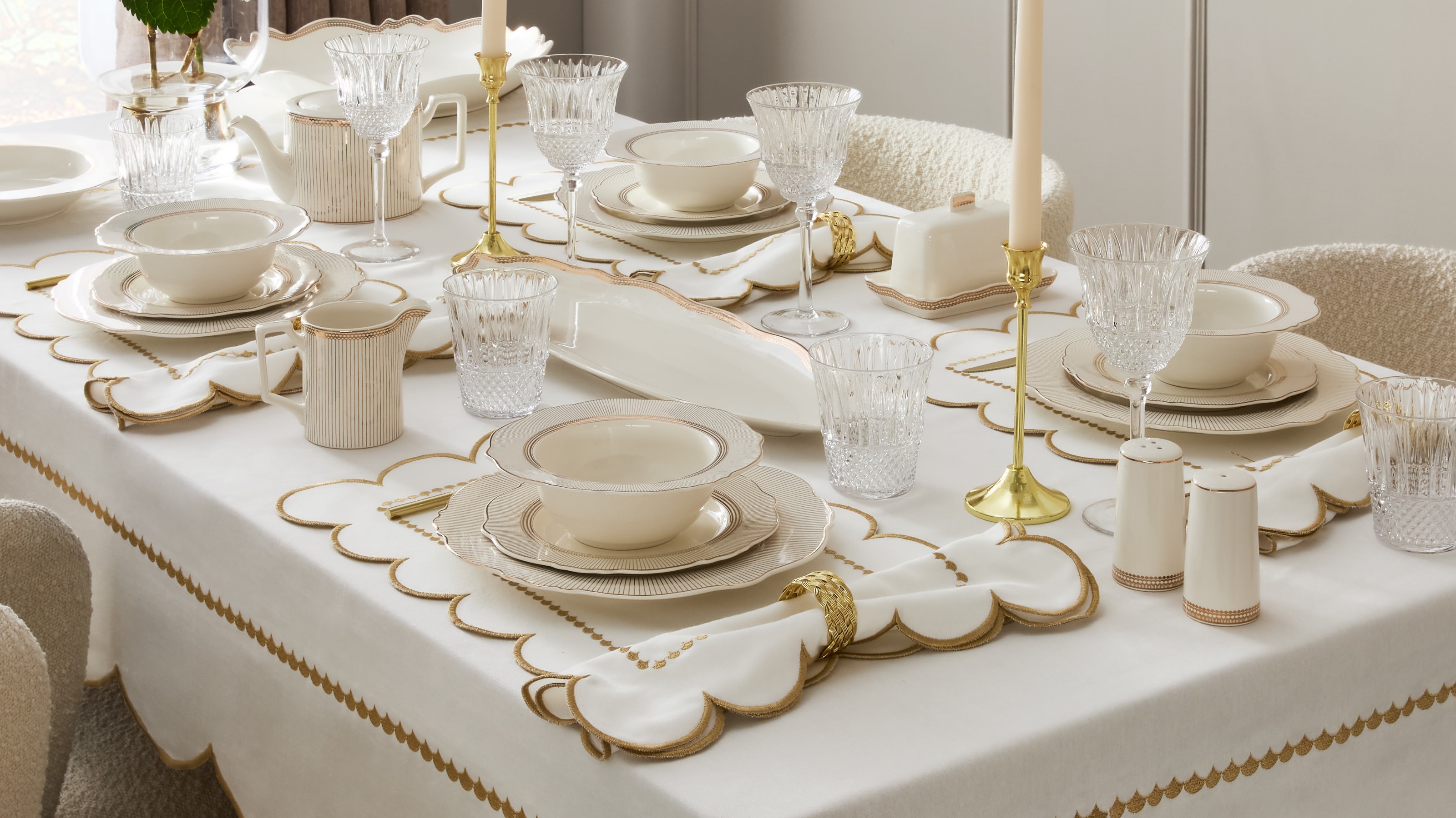 A dining table set with art deco-style pieces from the Primark Home The Edit collection