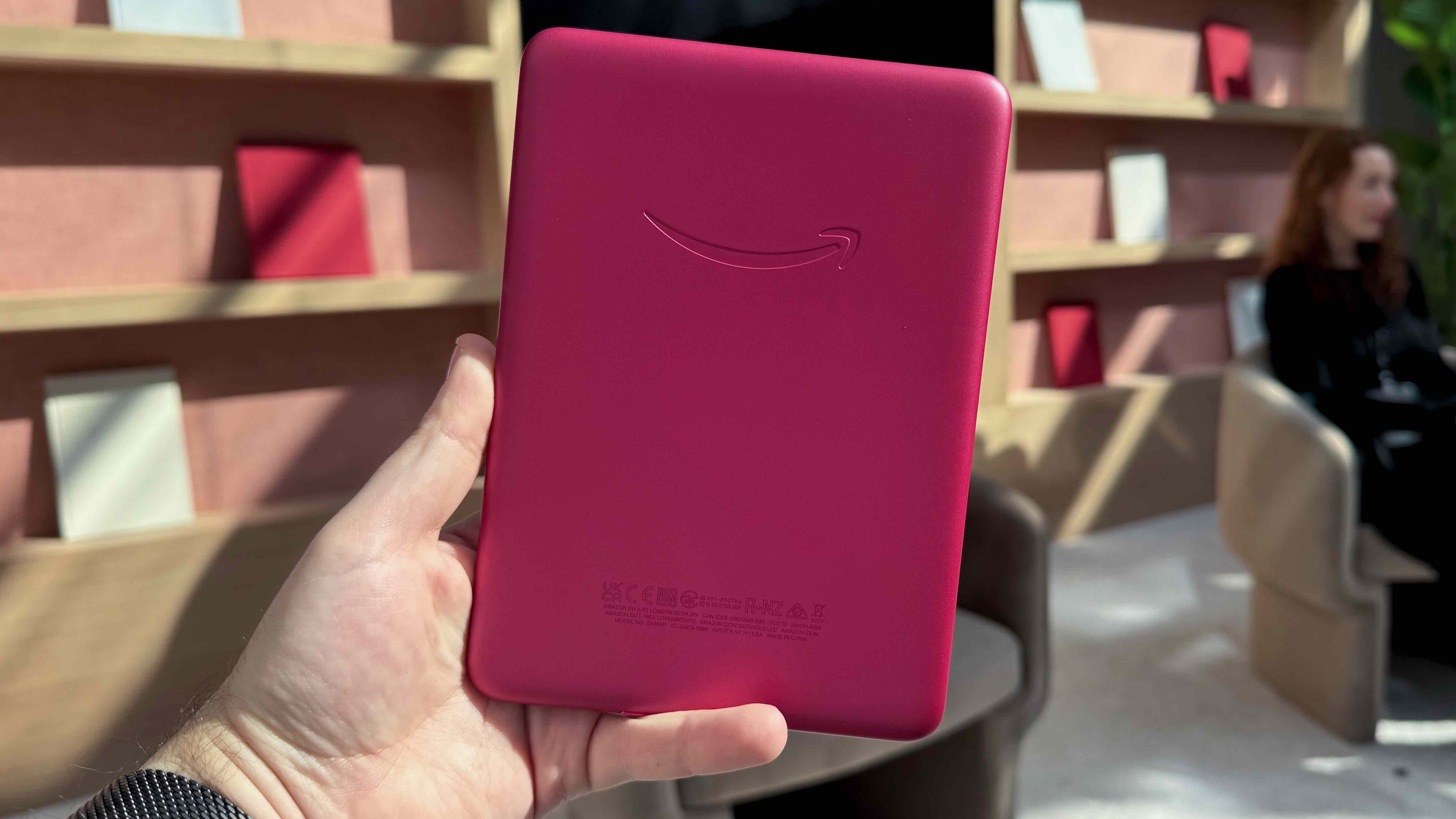 The rear of the Amazon Kindle Paperwhite Signature Edition in Raspberry.