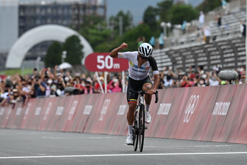 Ecuadors Richard Carapaz celebrates as he crosses the finish line to win the mens cycling road race during the Tokyo 2020 Olympic Games at the Fuji International Speedway in Oyama Japan on July 24 2021 Photo by Greg Baker AFP Photo by GREG BAKERAFP via Getty Images