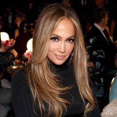 Jennifer Lopez wears white chunky sneakers with leggings and a Gucci jacket in L.A.