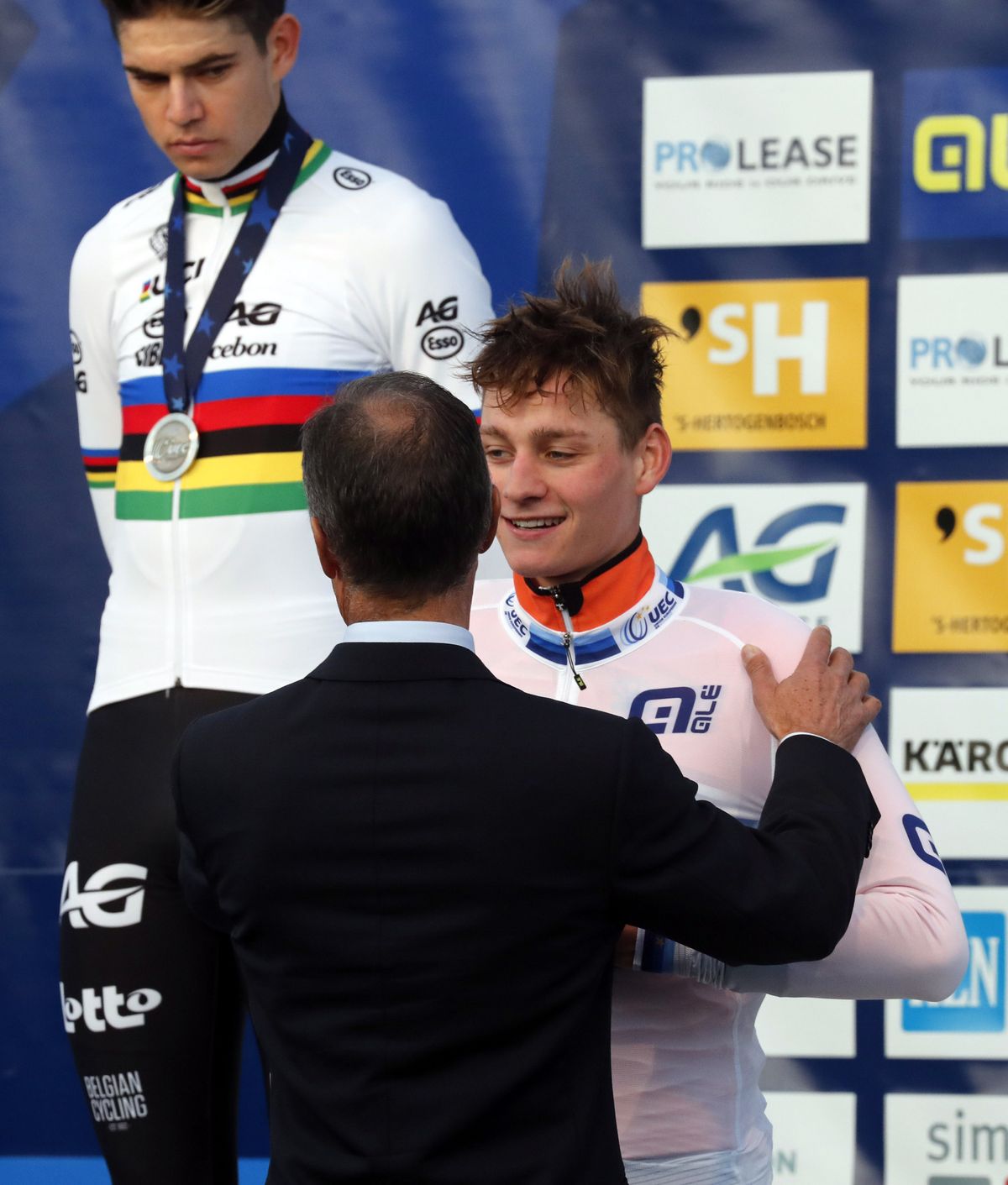 Wout van Aert looks on as Mathieu van der Poel is congratulated