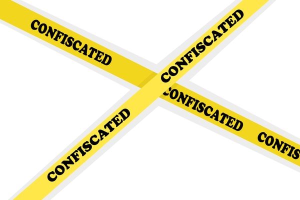 Yellow warning tape with confiscation text