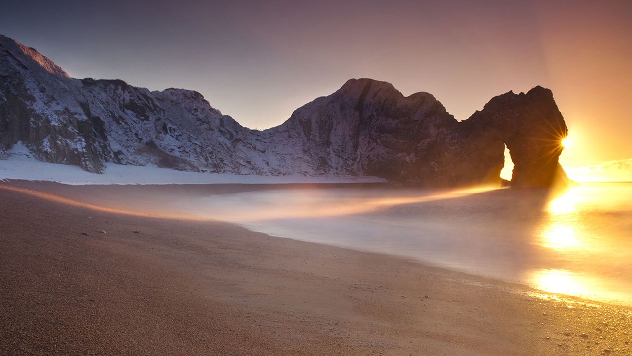 A beach at sunset