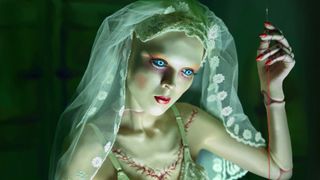 A marrionette in a bride's veil in American Horror Stories season 2 key art.