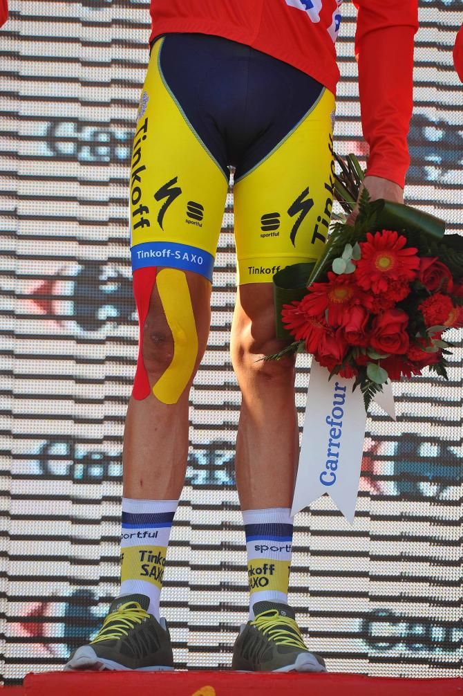 Contador's knee is wrapped in color-coordinated kinesio tape