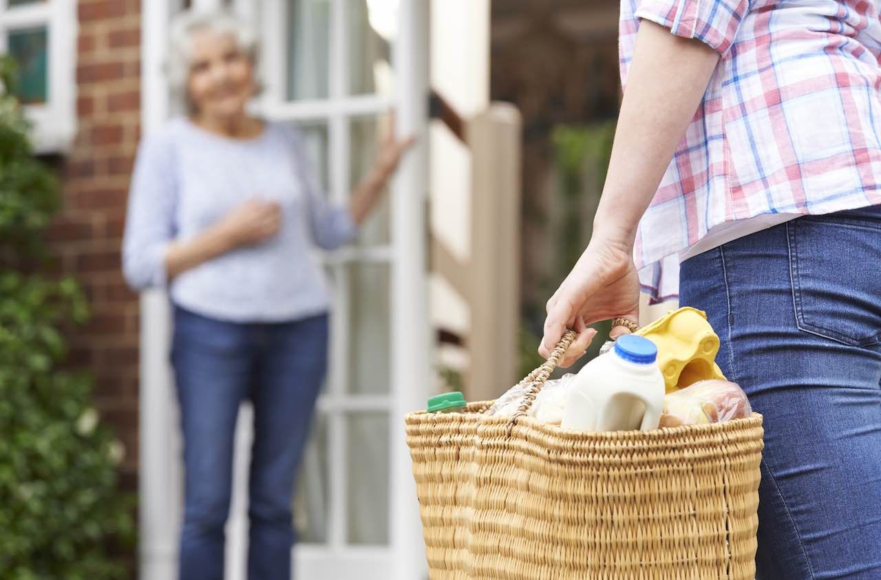 Person Doing Shopping For Elderly Neighbour