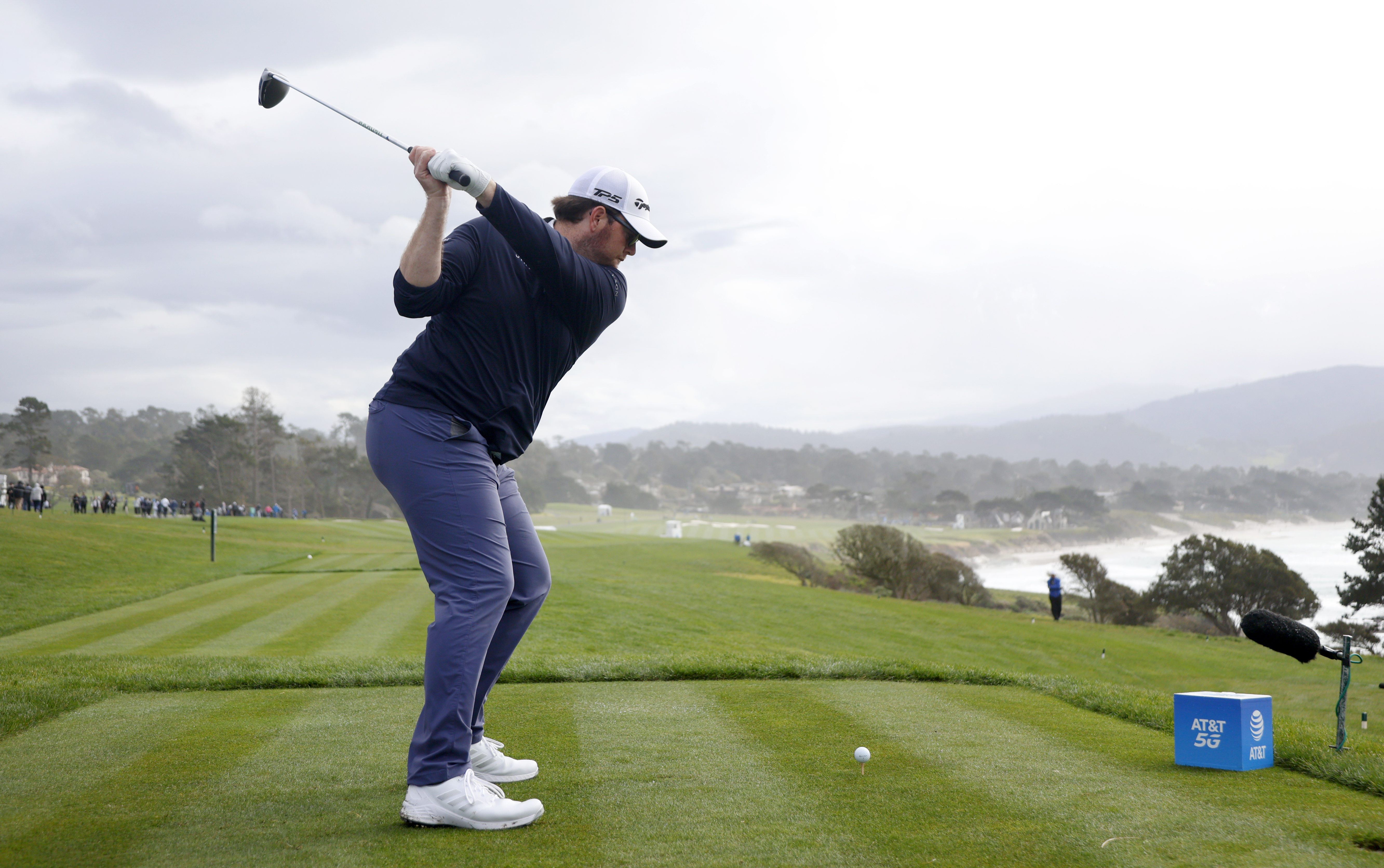 Higgs hits a tee shot at Pebble Beach