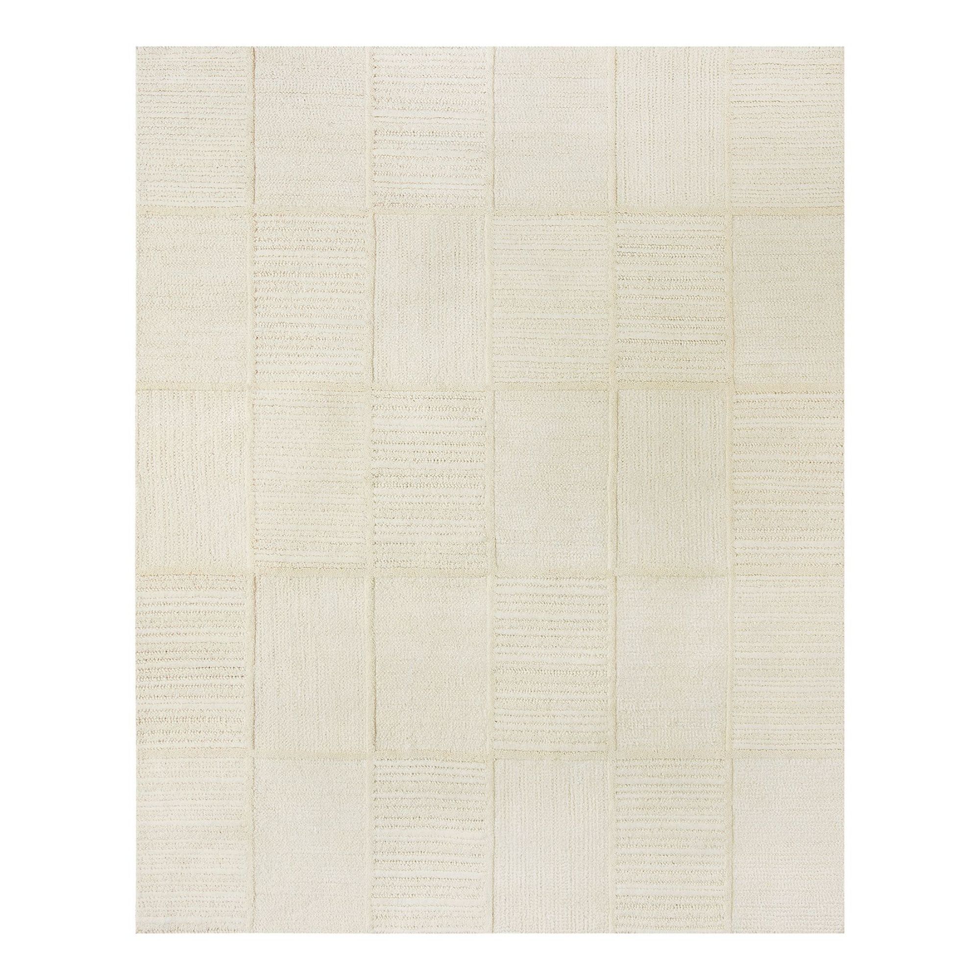 Cream wool rug with textured grid design