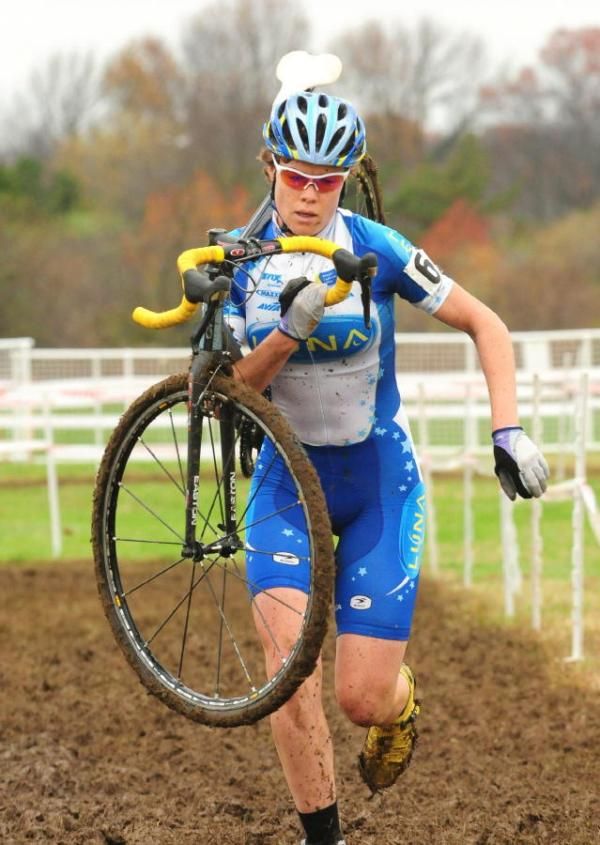 Georgia Gould (Luna Pro Team) carrying her bike on a long run.