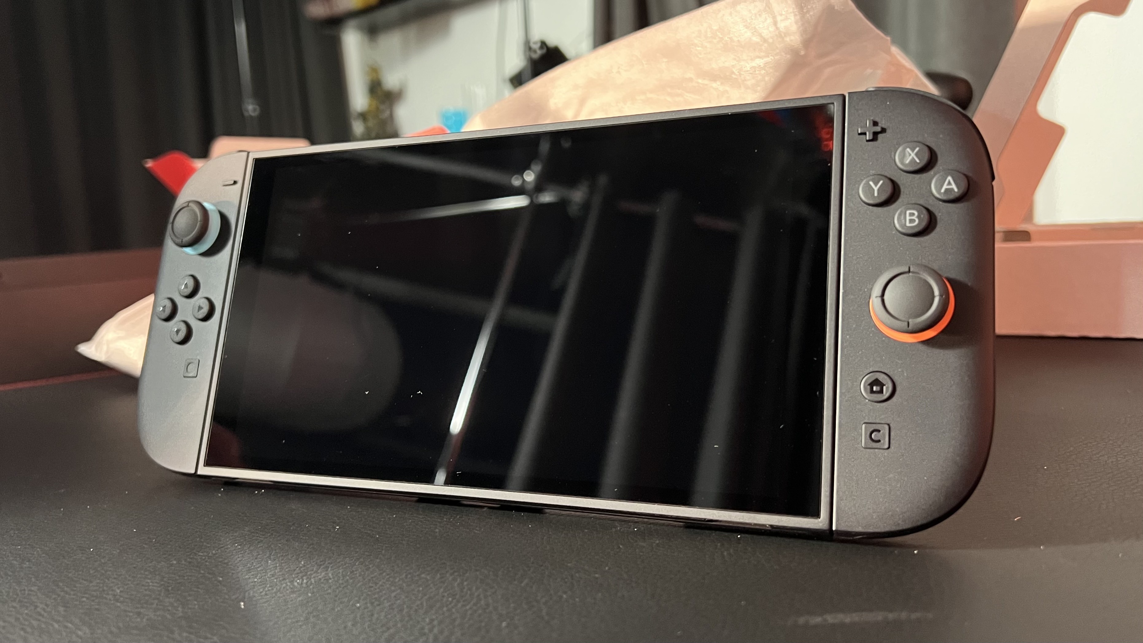 Nintendo Switch 2 handheld on a black desk