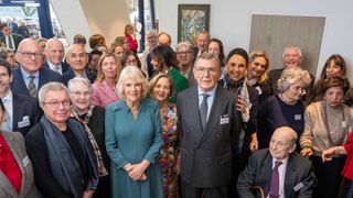 Queen Camilla poses with Dame Laura Lee, Maggie's Chief Executive, Mr Stuart Gulliver, Chairman of Maggie's and Daniel Libeskind, Architect of the new center and representatives of The Royal Free London during her visit to Maggie's new cancer support centre