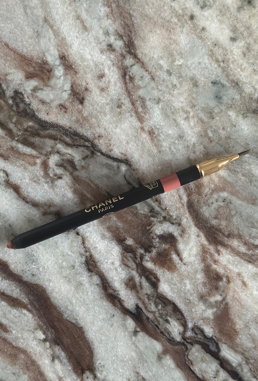 Chanel lip liner of a marbled table