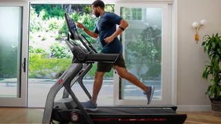 Best Bowflex deals: image of man running on Bowflex treadmill 