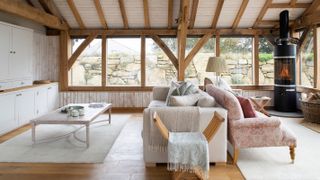 living room with vaulted ceiling in oak frame extension