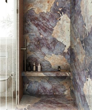 A walk-in shower stone drenched in granite