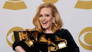 los angeles, ca february 12 singer adele, winner of the grammys for record of the year for rolling in the deep, album of the year for 21, song of the year for rolling in the deep, best pop solo performance for someone like you, best pop vocal album for 21 and best short form music video for rolling in the deep, poses in the press room at the 54th annual grammy awards at staples center on february 12, 2012 in los angeles, california photo by kevork djanseziangetty images