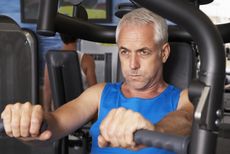 A man works out with weights.