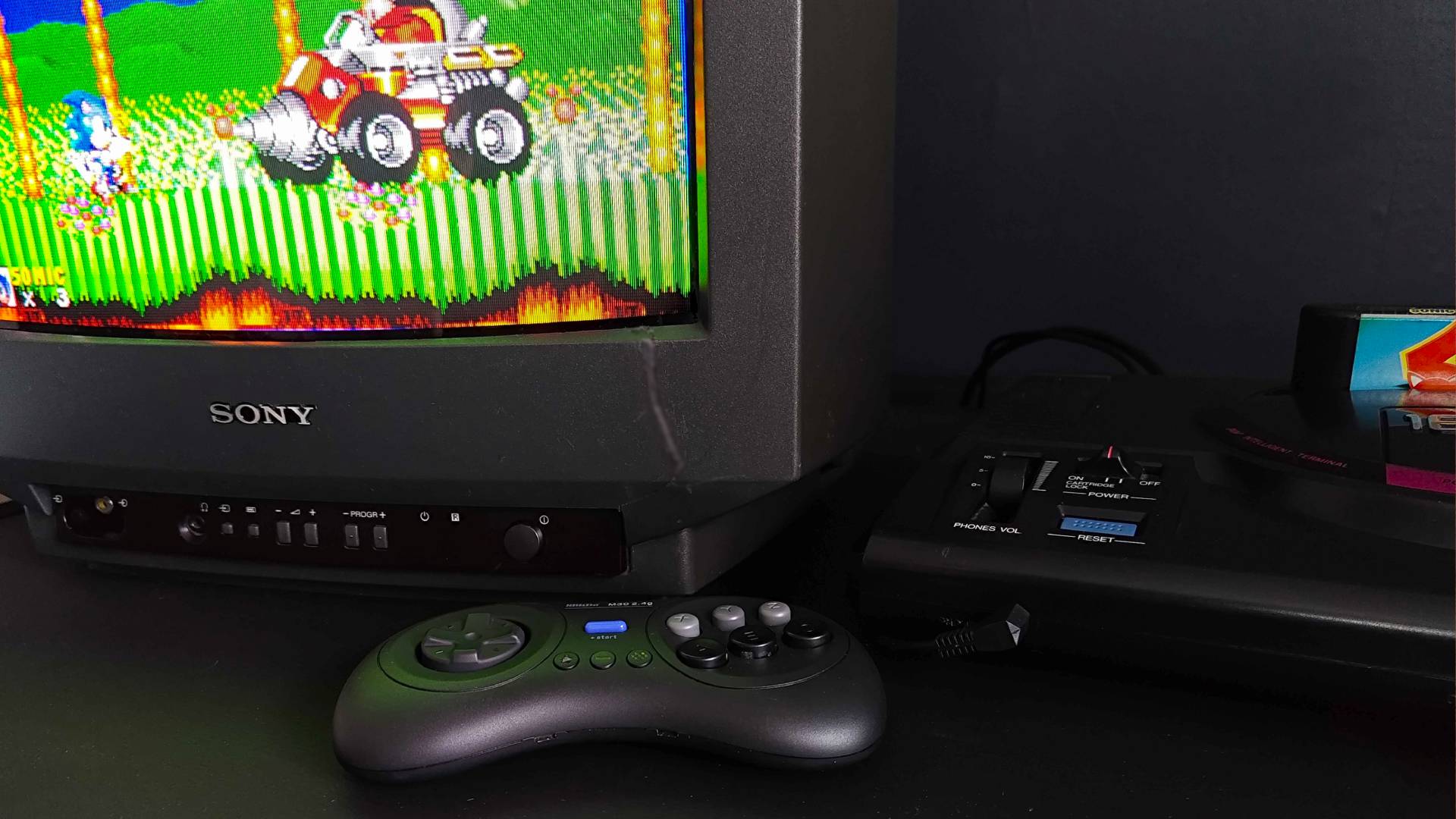 8Bitdo M30 next to Sega Mega Drive console and Sony CRT TV with Sonic the Hedgehog 2 on screen featuring first Dr Eggman boss fight.