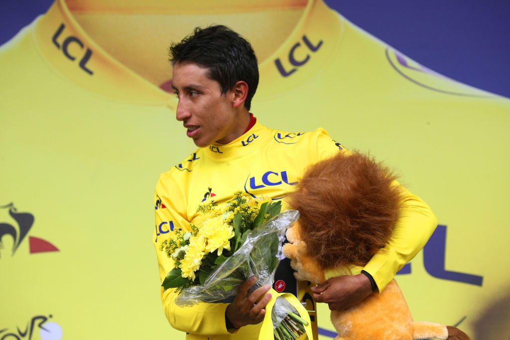 Egan Bernal (Team Ineos) squeezes his lion tight on the podium following the penultimate stage of the 2019 Tour de France