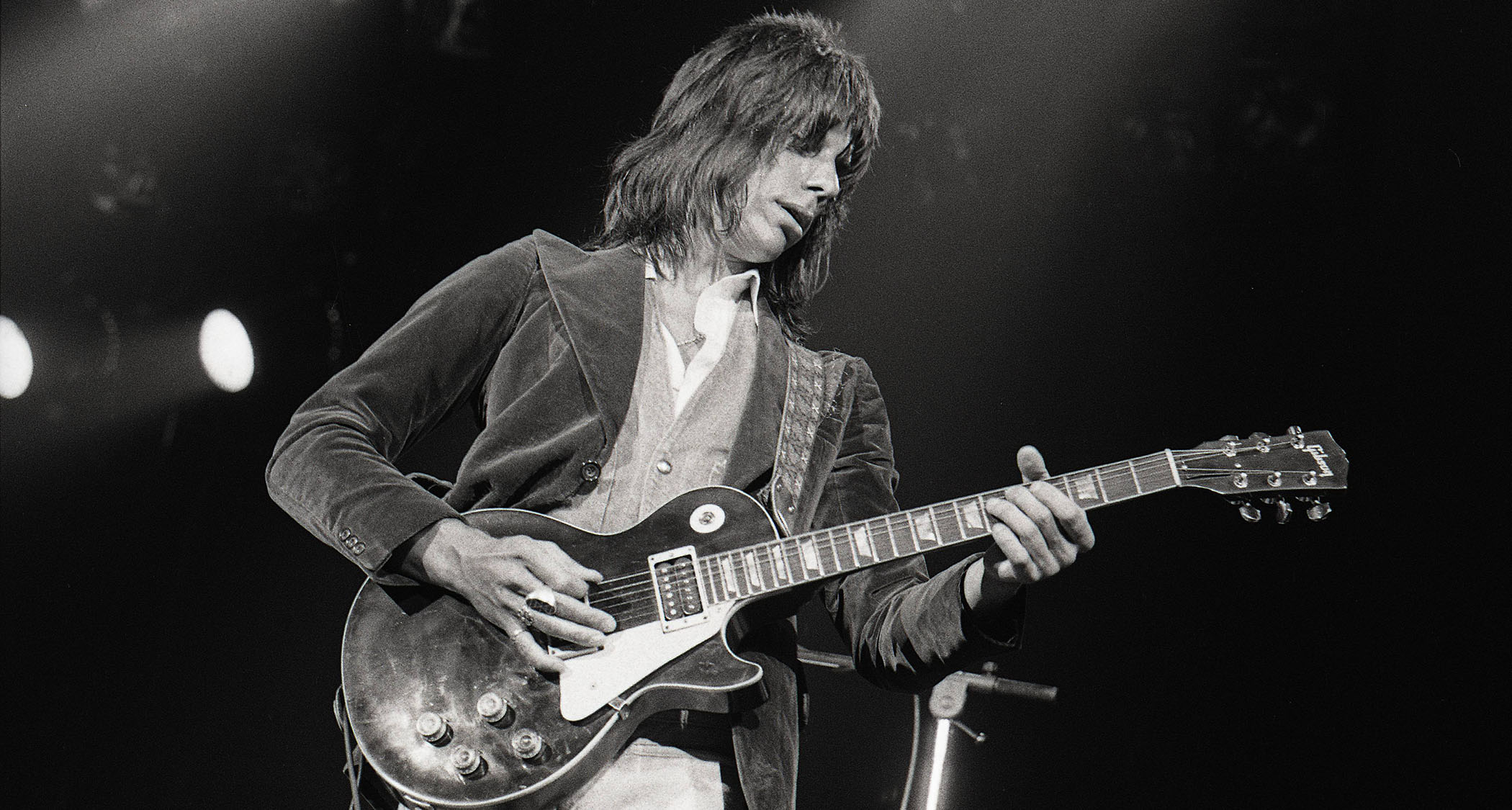 A black-and-white image of Jeff Beck playing a Les Paul live in 1973.
