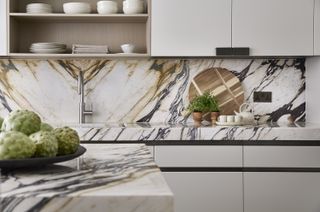 marble worktop in a modern kitchen with wooden chopping boards