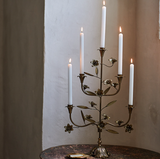 brass candelabra in a floral design