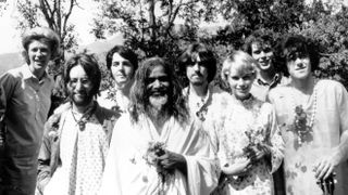 Donovan (right) with the Beatles and Maharishi Mahesh in India