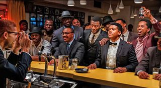 ONE NIGHT IN MIAMI 2020 Amazon Studios film From right Leslie Odom Jr Eli Goree and Aldis Hodge with Kingsley BenAdir as Malcolm X taking a photo of the group